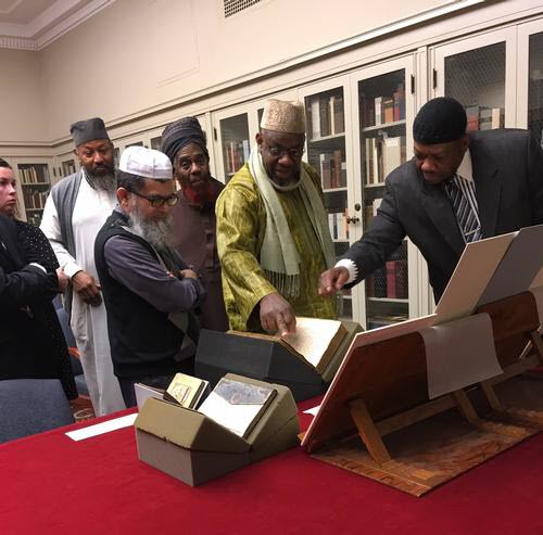 imams with Islamic manuscripts