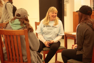 seated group of people having a conversation