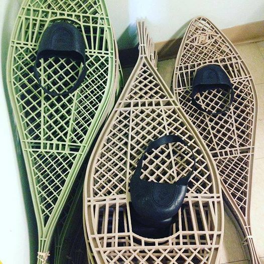 three stacks of snowshoes