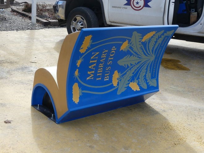 Outdoor bench designed and painted to look like an open book