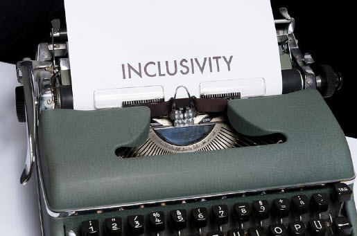 Close-up shot of a typewriter with a piece of paper and the word ‘inclusivity’ 