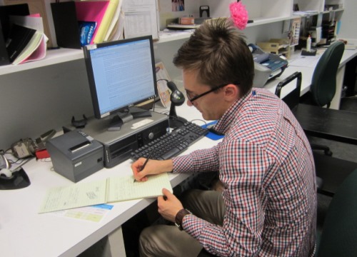 Danil Churzin. Library Assistant. Reading a Wikipedia article about Pinterest.