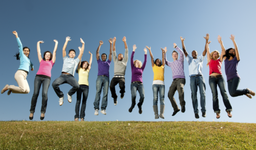 Diverse group of people jumping into the air