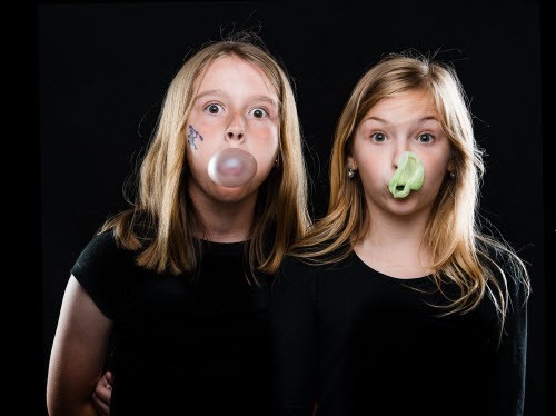Two 11-year-old girls geek bubblegum at Oak Bluffs (MA) Public Library