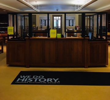 Photo: Reference Desk with plexiglass divider installed