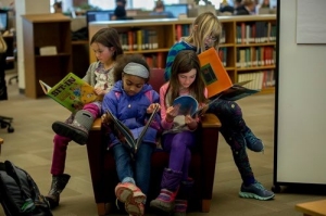 Photo: children reading, by Phyllis Graber Jensen/Bates College children reading