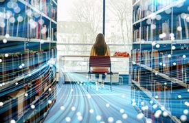 inset-wj-articlepg-ai-on-horizon A woman sits alone on a chair in a library, facing a large window with a view of trees outside. Bookshelves filled with books line both sides of the aisle. Overlaid on the image are abstract digital light trails and glowing dots, symbolizing the integration of technology and information in a modern library setting.