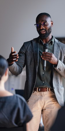  male presenter speaking