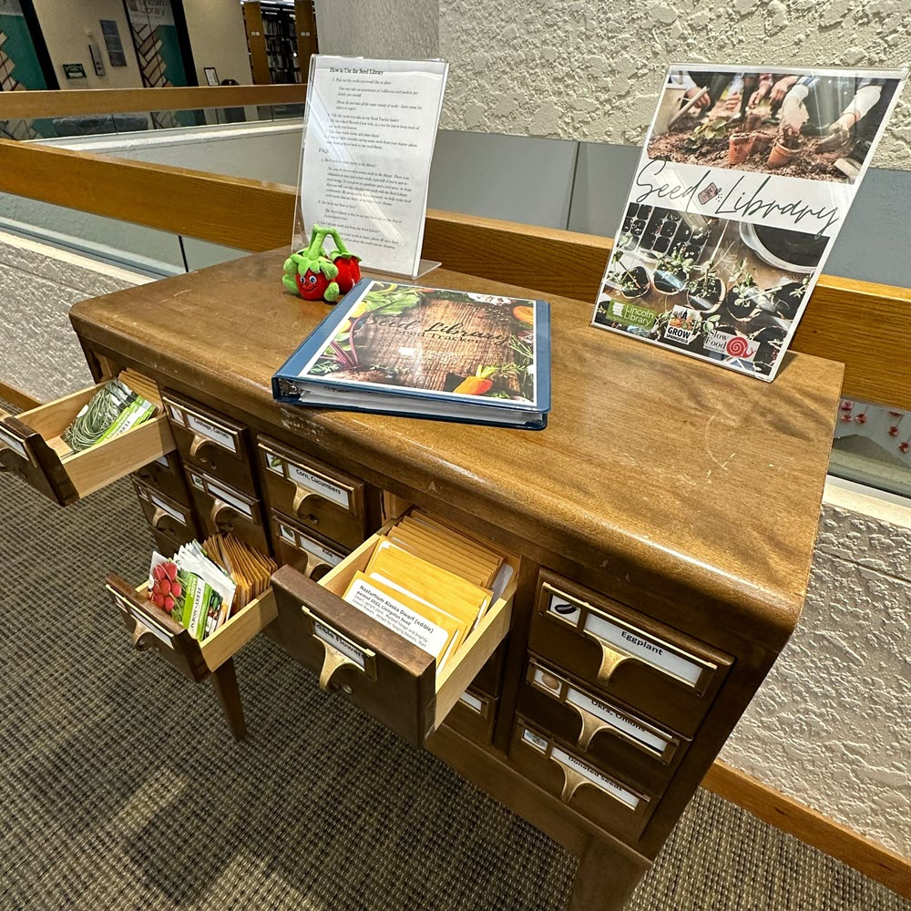wooden card catalog with seed library display